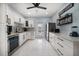 Eat-in kitchen features stainless steel appliances, white cabinets, and access to the backyard at 316 Hillpoint Dr, Palm Harbor, FL 34683