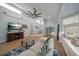 Bright living room boasts modern furnishings, hardwood floors, and multiple windows for natural light at 316 Hillpoint Dr, Palm Harbor, FL 34683