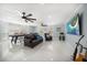 Spacious living room with hardwood flooring, TV, and comfortable seating area at 316 Hillpoint Dr, Palm Harbor, FL 34683