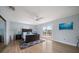 Light-filled main bedroom with hardwood floors and access to waterfront deck at 316 Hillpoint Dr, Palm Harbor, FL 34683
