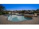 Evening view of a backyard pool with hot tub and waterfront access in a residential neighborhood at 316 Hillpoint Dr, Palm Harbor, FL 34683