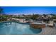 Backyard pool and spa featuring brick pavers and waterfront views of the canal at 316 Hillpoint Dr, Palm Harbor, FL 34683