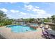 Backyard pool and patio area with waterfront views at 316 Hillpoint Dr, Palm Harbor, FL 34683