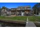 Waterfront home with multi-level deck, pool, patio, and dock, perfect for outdoor entertaining and relaxation at 316 Hillpoint Dr, Palm Harbor, FL 34683