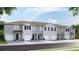 Modern townhome with gray exterior, black shutters and doors, and attached garages at 32417 Welling Blade Loop, Wesley Chapel, FL 33545