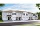 Townhome featuring a neutral palette, garage, and manicured landscaping at 32417 Welling Blade Loop, Wesley Chapel, FL 33545