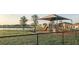 Community playground with shaded picnic area by the lake at 32417 Welling Blade Loop, Wesley Chapel, FL 33545