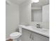 Modern bathroom with a white vanity, sleek fixtures, and a pristine toilet, providing a clean and functional space at 3412 W San Juan St # A, Tampa, FL 33629