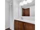 Stylish bathroom with a rich wood vanity, modern sink, and a unique tiled shower, blending luxury with functional design at 3412 W San Juan St # A, Tampa, FL 33629