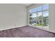 Sun-filled bedroom with a large window overlooking a serene neighborhood, providing a comfortable and inviting retreat at 3412 W San Juan St # A, Tampa, FL 33629