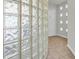 Bright hallway with unique glass block wall and tiled floors at 3412 W San Juan St # A, Tampa, FL 33629