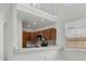 Charming kitchen featuring ample cabinets, modern appliances, breakfast bar, and a mosaic backsplash at 3412 W San Juan St # A, Tampa, FL 33629