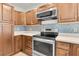Beautiful kitchen featuring stainless steel appliances, custom cabinets, and a mosaic backsplash at 3412 W San Juan St # A, Tampa, FL 33629