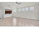 Spacious living room with tiled floors, ceiling fan and an open floor plan to the kitchen at 3412 W San Juan St # A, Tampa, FL 33629
