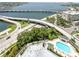 Aerial view showcasing the waterway, bridge, and complex's inviting pool at 345 Bayshore Blvd # 1807, Tampa, FL 33606