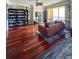 Inviting living room showcasing hardwood floors, comfortable seating, and a wall of built-in shelving for storage at 345 Bayshore Blvd # 1807, Tampa, FL 33606