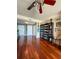 Spacious living room with hardwood floors, ceiling fan, and shelving unit at 345 Bayshore Blvd # 1807, Tampa, FL 33606