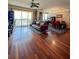 Open floor plan featuring hardwood floors, balcony, comfortable seating, and dining area at 345 Bayshore Blvd # 1807, Tampa, FL 33606