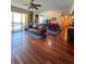 Open floor plan with a balcony, living area, dining space and hardwood floors at 345 Bayshore Blvd # 1807, Tampa, FL 33606