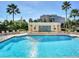 Bright pool with lounge chairs and landscaping on a clear day at 345 Bayshore Blvd # 1807, Tampa, FL 33606