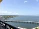 Expansive water view from the unit's balcony with a bridge, clear blue skies, and distant waterfront homes at 345 Bayshore Blvd # 1807, Tampa, FL 33606
