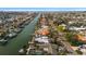 Scenic aerial view of waterfront homes along a canal, each with private docks and lush landscaping at 3830 46Th S Ave, St Petersburg, FL 33711