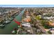 Waterfront home on a canal featuring a private boat dock and lush landscaping at 3830 46Th S Ave, St Petersburg, FL 33711