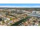 Scenic aerial view of a waterfront community featuring lush landscaping, private docks, and nearby city skyline at 3830 46Th S Ave, St Petersburg, FL 33711