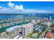 Waterfront condo building with a pool and surrounding residential neighborhood at 400 Island Way # 502, Clearwater Beach, FL 33767