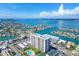 Breathtaking aerial showcasing the condominium location along the water with nearby homes at 400 Island Way # 502, Clearwater Beach, FL 33767