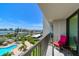 A balcony overlooking a pool and waterfront at 400 Island Way # 502, Clearwater Beach, FL 33767