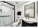Bathroom featuring a walk-in shower and a black vanity at 400 Island Way # 502, Clearwater Beach, FL 33767