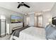Bright bedroom showcases a large TV, complementing the spacious layout and inviting atmosphere at 400 Island Way # 502, Clearwater Beach, FL 33767