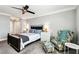 Bedroom with a bed and reading chair near to a window with great natural light at 400 Island Way # 502, Clearwater Beach, FL 33767