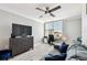 Bedroom featuring neutral walls, seating, ceiling fan, and a view from the window at 400 Island Way # 502, Clearwater Beach, FL 33767