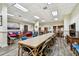 Resident room features a long dining table and two sitting areas at 400 Island Way # 502, Clearwater Beach, FL 33767