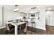 Open dining area offers barstool seating looking into the updated kitchen space at 400 Island Way # 502, Clearwater Beach, FL 33767