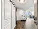 Welcoming foyer with tile floors, storage closet, and view of the living room at 400 Island Way # 502, Clearwater Beach, FL 33767