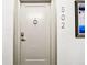 The front door to unit 502 with door knocker and modern lock at 400 Island Way # 502, Clearwater Beach, FL 33767