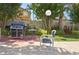 Community grilling area with stainless steel gas grill and comfortable seating at 400 Island Way # 502, Clearwater Beach, FL 33767