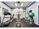 Community gym featuring a treadmill, weights, and various exercise equipment, promoting a healthy lifestyle at 400 Island Way # 502, Clearwater Beach, FL 33767