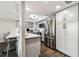 Charming kitchen with stainless steel appliances, white cabinets, marble backsplash, and hardwood floors at 400 Island Way # 502, Clearwater Beach, FL 33767