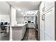 Updated kitchen with stainless steel appliances, gray cabinets, and breakfast bar at 400 Island Way # 502, Clearwater Beach, FL 33767