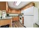 A kitchenette with white appliances at 400 Island Way # 502, Clearwater Beach, FL 33767