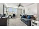 Versatile living area with sleek ceiling fan, blends relaxation with a functional workspace bathed in natural light at 400 Island Way # 502, Clearwater Beach, FL 33767