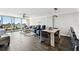 Bright living room with comfortable seating, city views, and access to a balcony at 400 Island Way # 502, Clearwater Beach, FL 33767