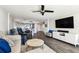 Open-concept living room featuring modern furnishings, wood floors, and a flat-screen TV at 400 Island Way # 502, Clearwater Beach, FL 33767