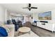 Spacious open-concept living area with entertainment center, dining, and an updated kitchen view at 400 Island Way # 502, Clearwater Beach, FL 33767