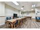 Large community lounge featuring a long table, seating, and a tv area at 400 Island Way # 502, Clearwater Beach, FL 33767