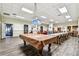 Spacious recreation room with a pool table, dining table, and access to a lounge area at 400 Island Way # 502, Clearwater Beach, FL 33767